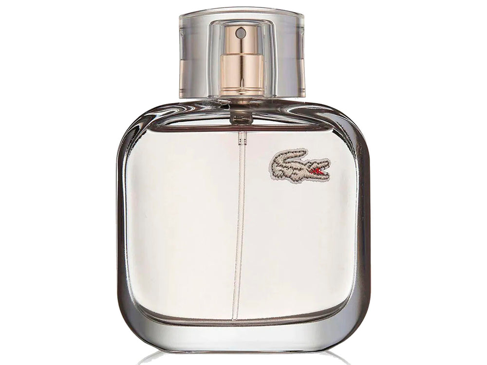 Botella de perfume Lacoste L.12.12 Pour Elle Elegant transparente junto a su caja blanca.