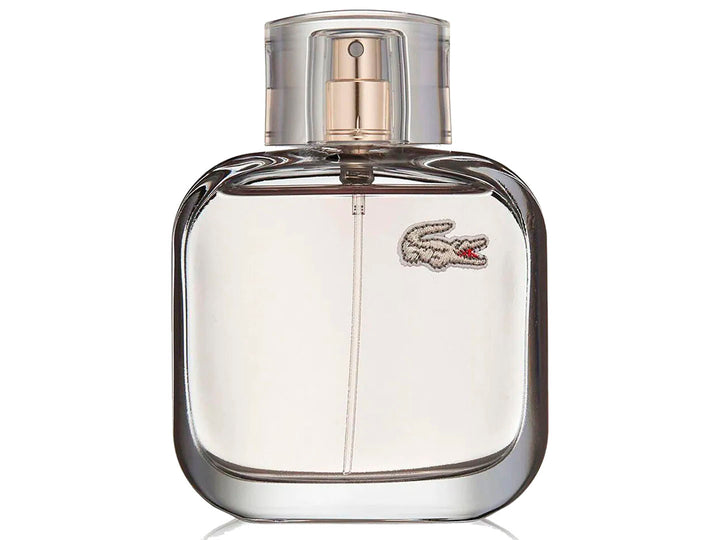 Botella de perfume Lacoste L.12.12 Pour Elle Elegant transparente junto a su caja blanca.