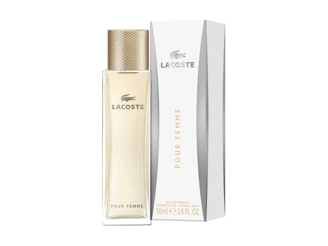 Frasco de perfume Lacoste Pour Femme en color dorado junto a su caja blanca.