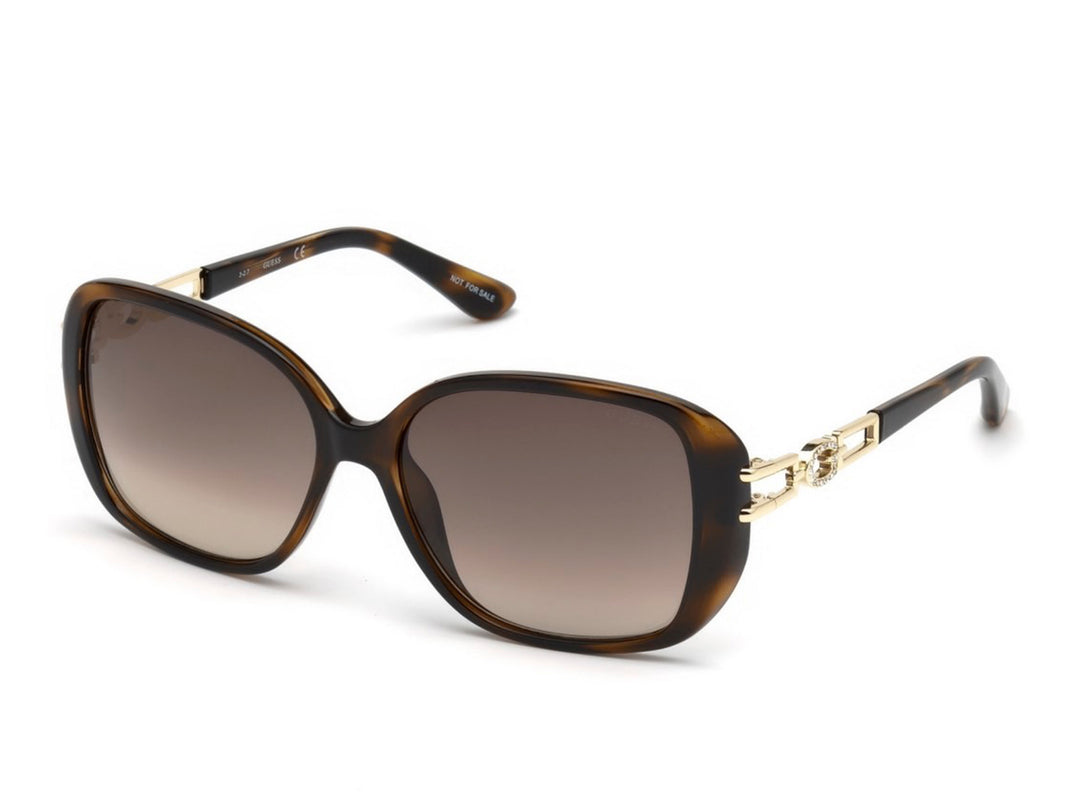 Lentes de sol Guess para mujer en color marrón carey con detalles dorados y cristales degradados.
