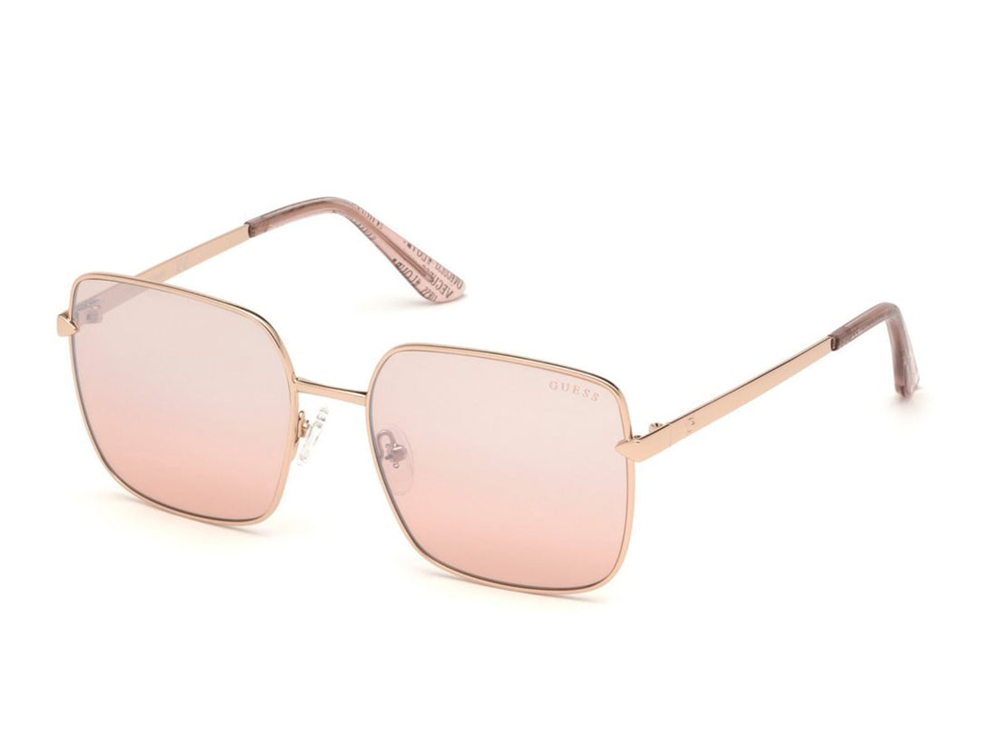 Lentes de sol Guess para mujer con montura metálica oro rosa y cristales degradados en tono rosa.