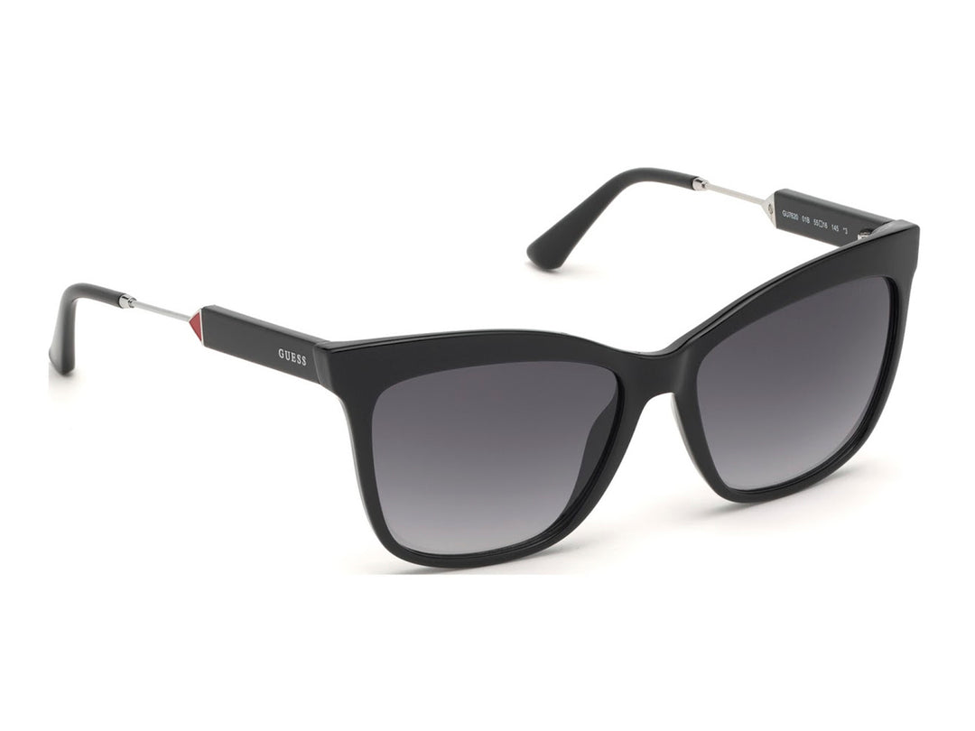 Lentes de sol Guess para mujer en color negro con cristales degradados y detalles metálicos.
