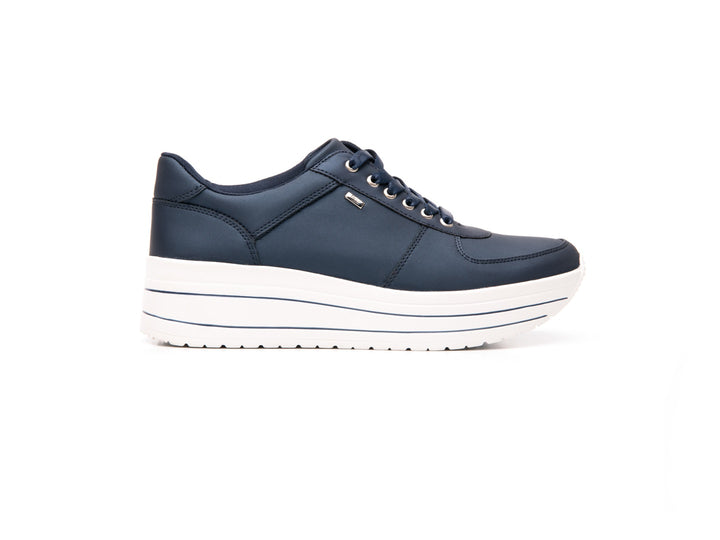 Tenis Flexi Alanis para mujer en color azul marino con suela blanca y agujetas coordinadas.