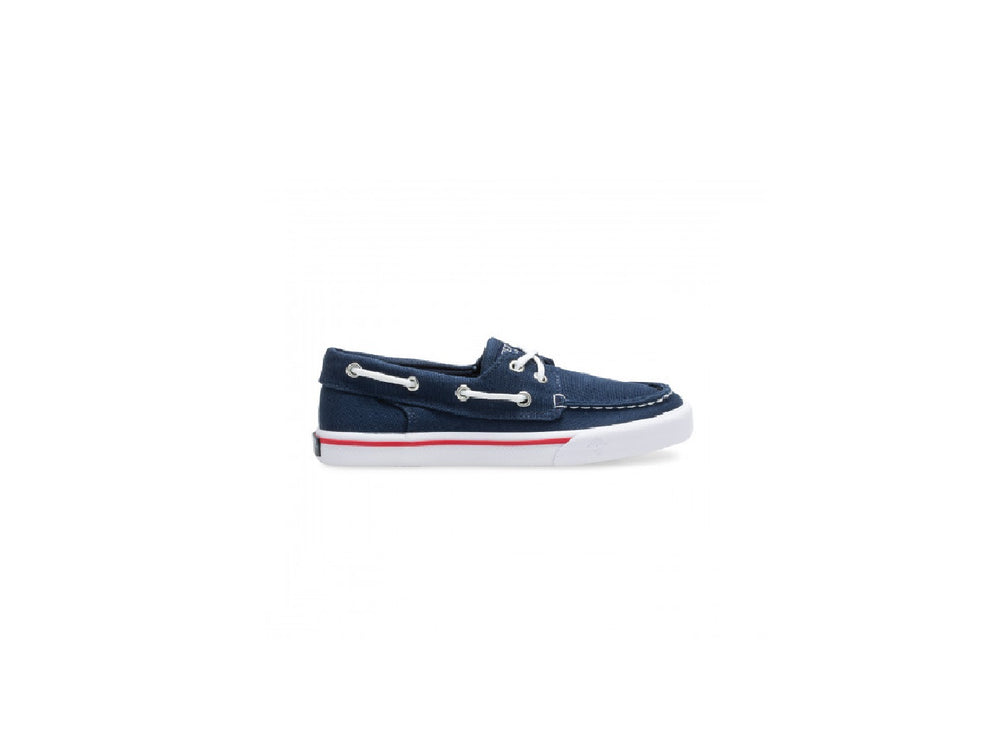 Zapato náutico Sperry azul marino para niño con suela blanca y un detalle en rojo.