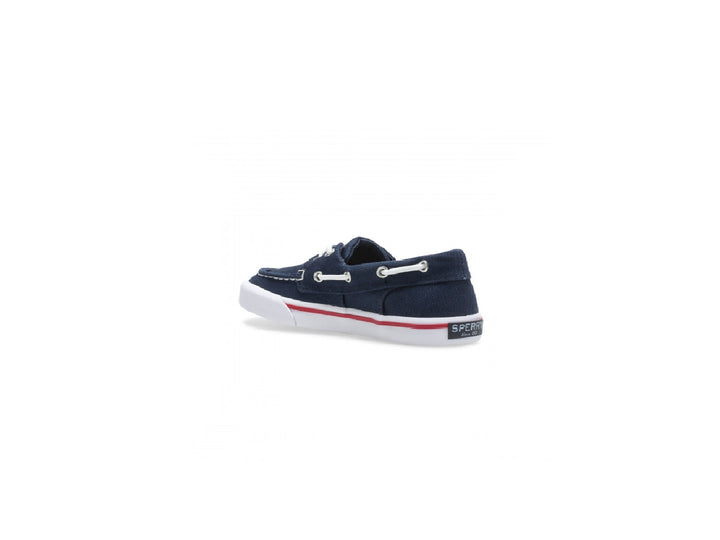 Zapato náutico Sperry azul marino para niño con suela blanca y un detalle en rojo.