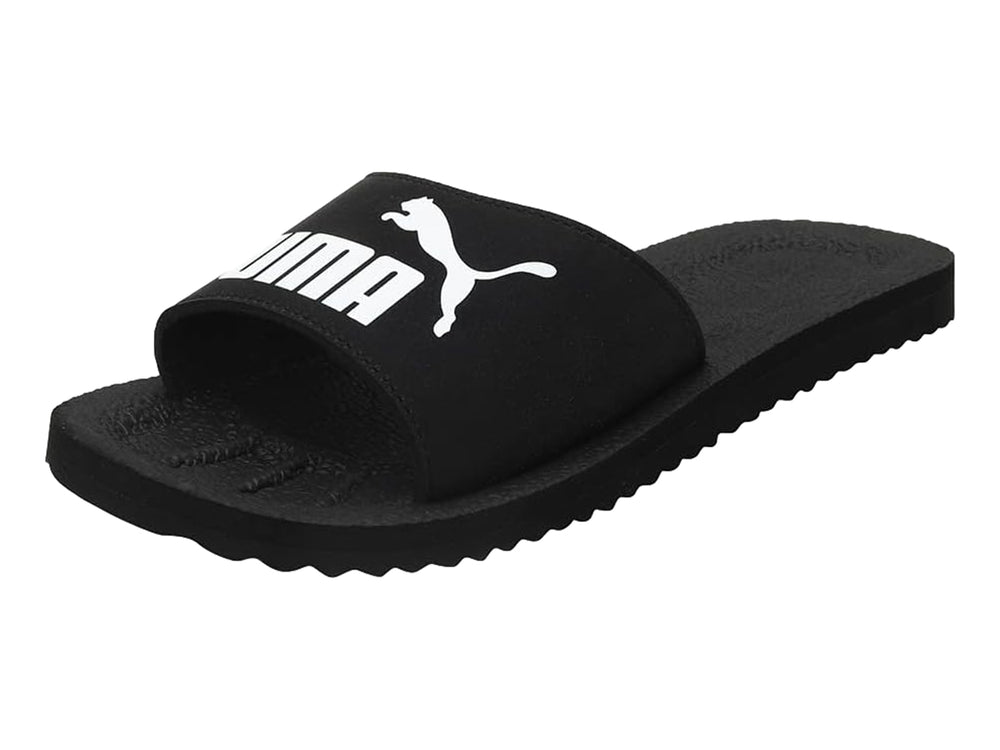 Sandalias PUMA PureCat en color negro con logotipo blanco en la banda superior.