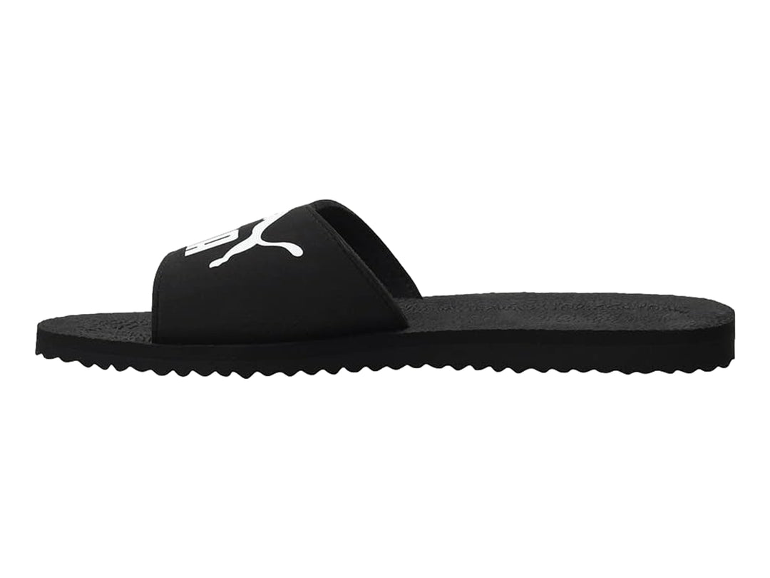 Sandalias PUMA PureCat en color negro con logotipo blanco en la banda superior.