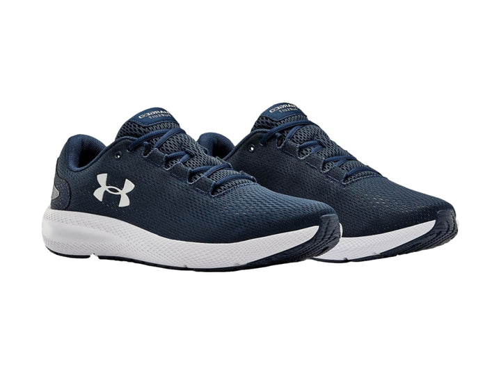 Tenis deportivos Under Armour en color azul marino con suela blanca y logotipo blanco.
