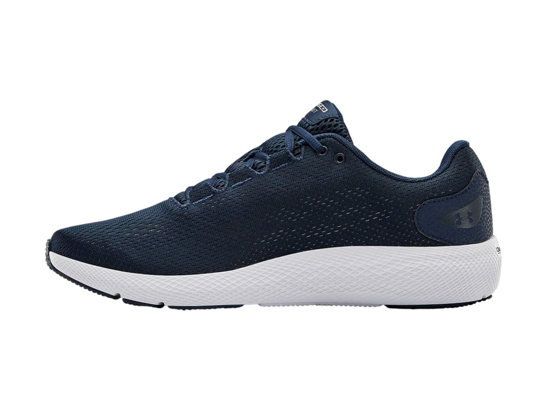 Tenis deportivos Under Armour en color azul marino con suela blanca y logotipo blanco.