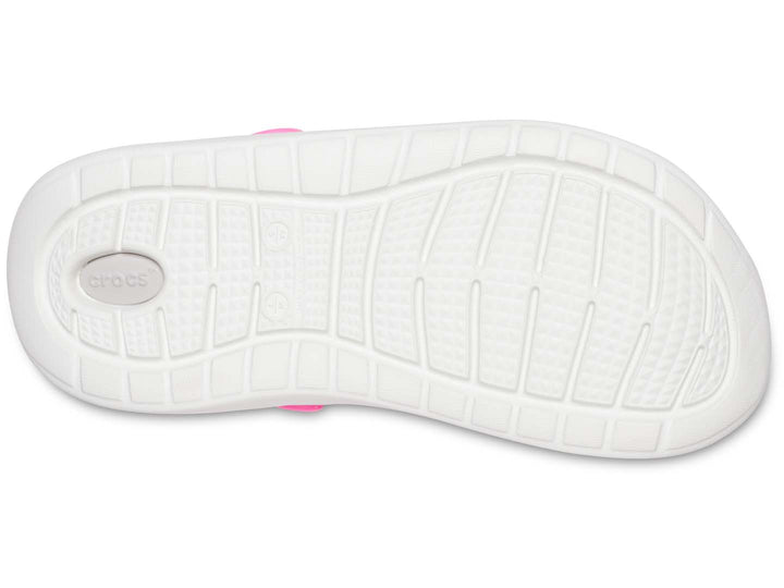 Zuecos Crocs LiteRide para mujer en color rosa eléctrico con suela blanca y correa ajustable.