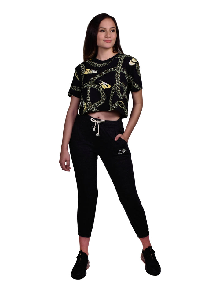 Pantalones deportivos Nike color negro para mujer con cordón ajustable en la cintura.