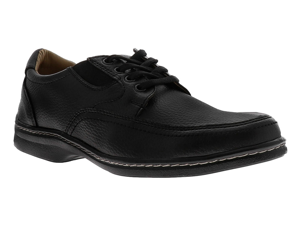 Zapato casual negro con cordones y costuras blancas decorativas en la suela.