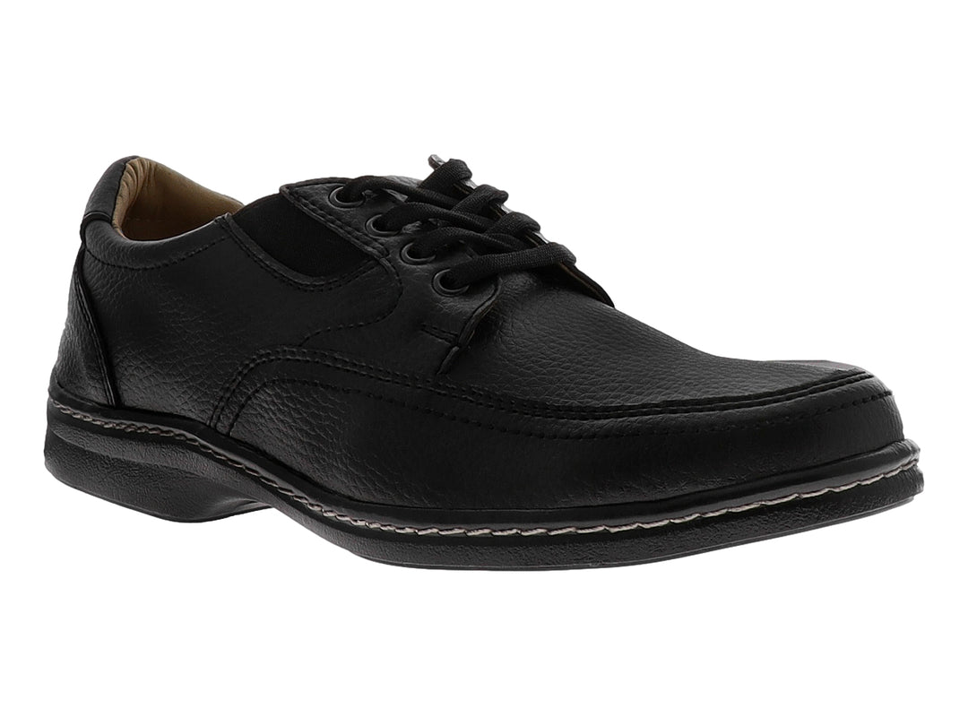Zapato casual negro con cordones y costuras blancas decorativas en la suela.