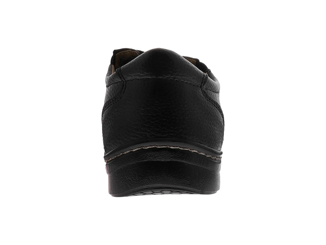 Zapato casual negro con cordones y costuras blancas decorativas en la suela.