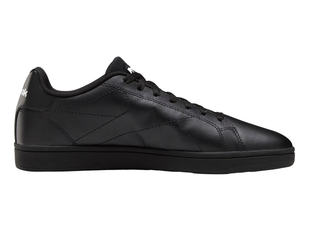 Tenis Reebok color negro con suela plana y diseño deportivo de corte bajo.