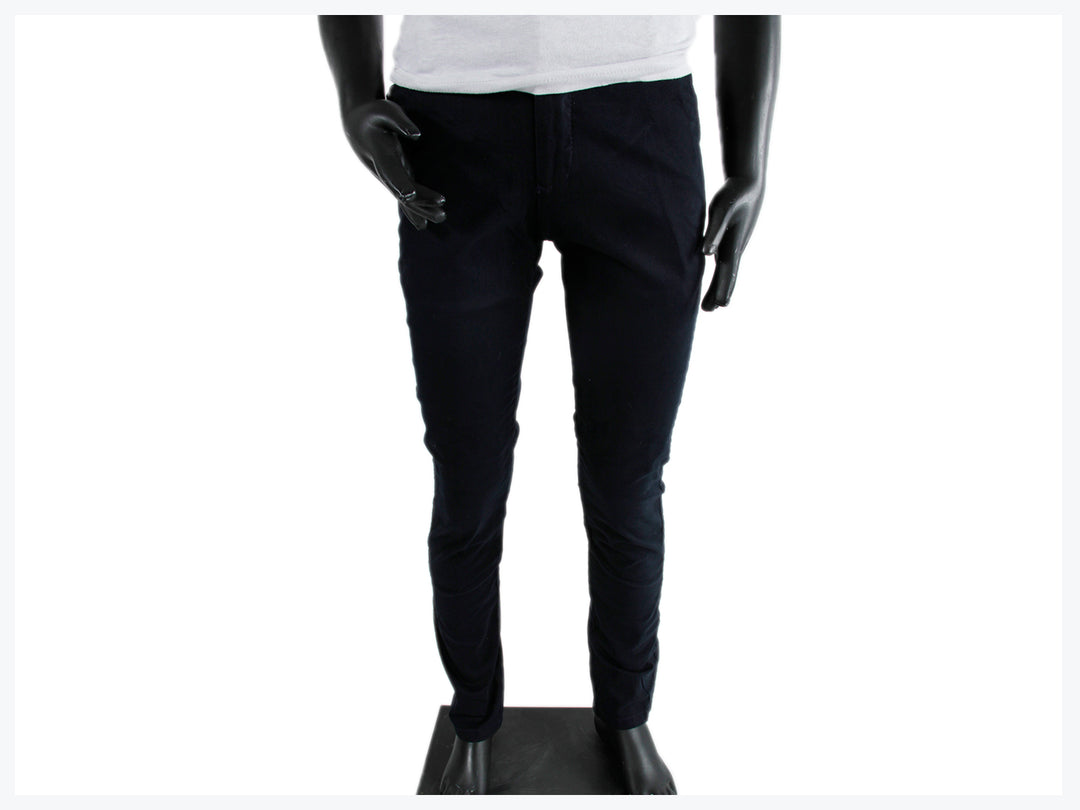 Pantalón largo ajustado color azul marino para niño exhibido en maniquí.