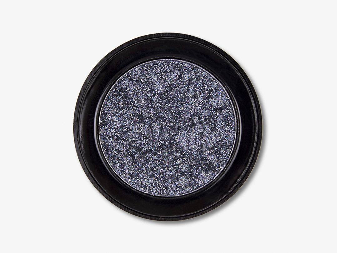 Sombra de ojos Pink Up Glitter Eye color holograma en envase circular negro visto desde arriba.