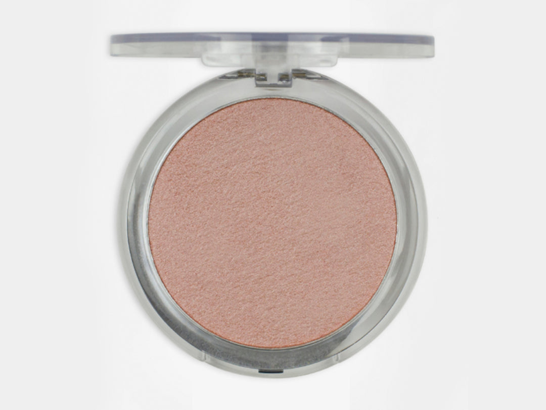 Iluminador Pink Up Sun en tono beige dentro de un estuche circular transparente.