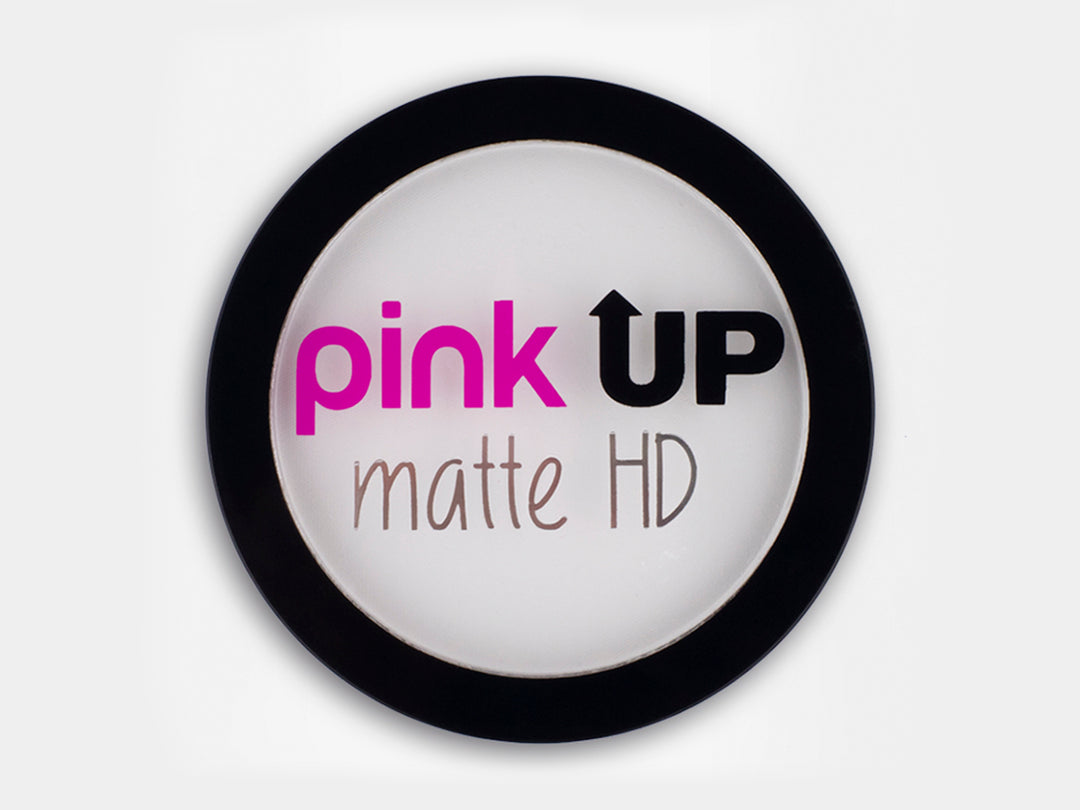 Polvo traslúcido Pink Up Matte HD en envase circular con borde negro y centro blanco.