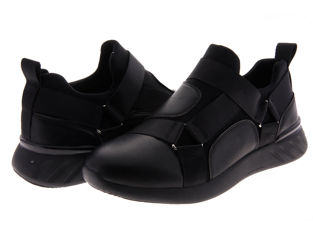 Par de tenis negros estilo slip-on con correas elásticas sobre fondo blanco.