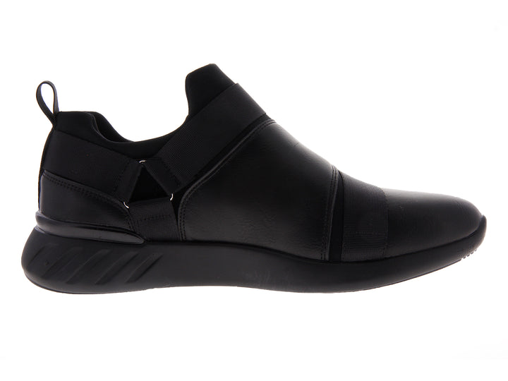 Par de tenis negros estilo slip-on con correas elásticas sobre fondo blanco.