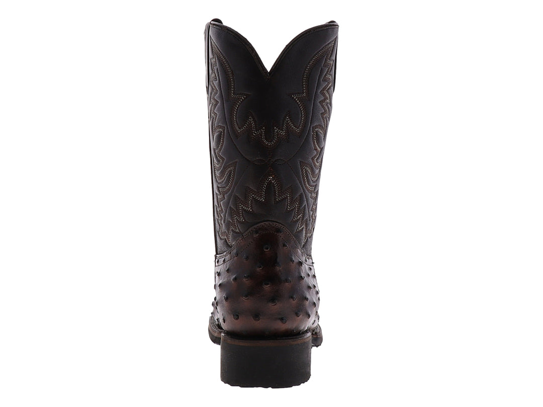 Bota vaquera de piel de avestruz color chocolate con bordados decorativos y suela negra.