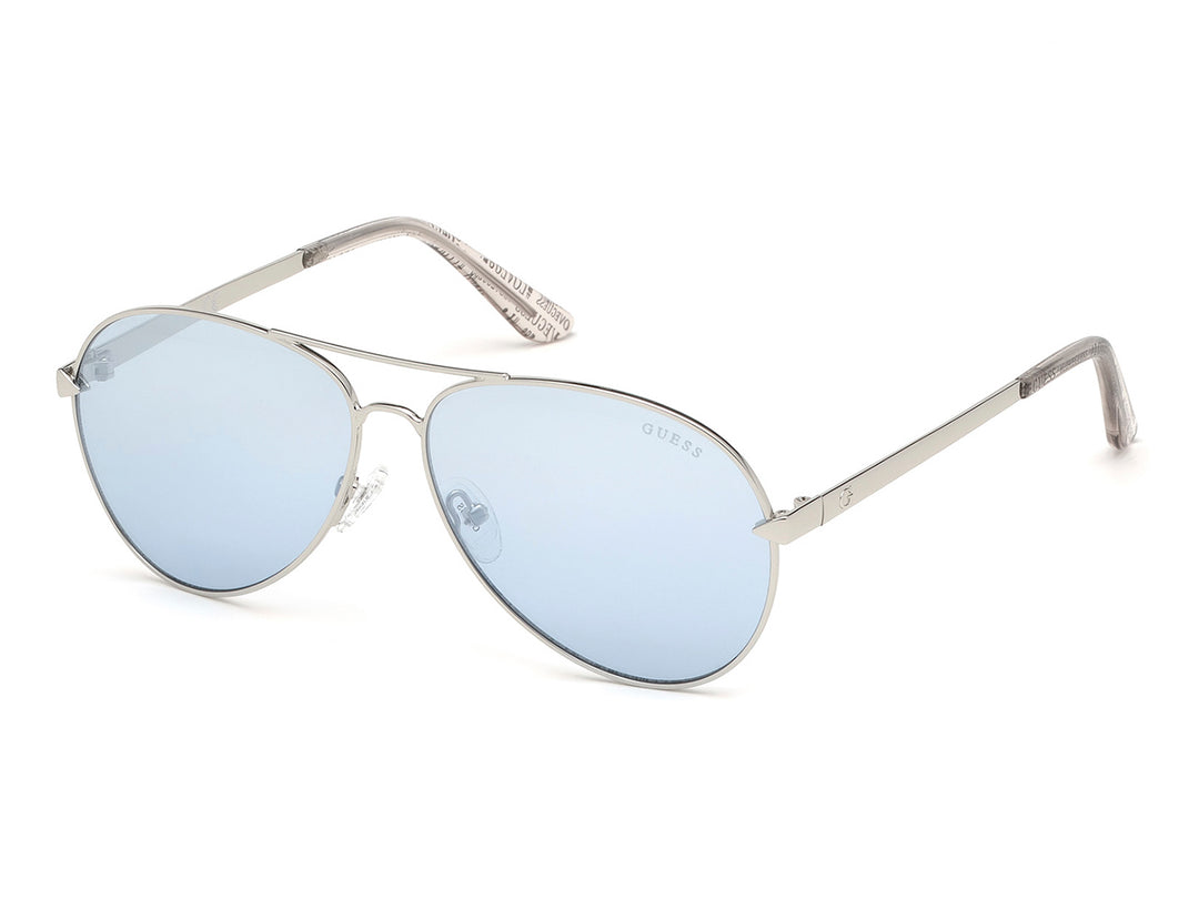 Lentes de sol Guess estilo aviador con armazón plateado y micas en color azul claro para mujer.