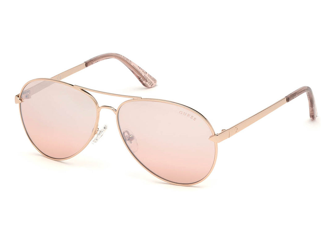 Lentes de sol Guess para mujer con montura metálica dorada y cristales en tono rosa degradado.