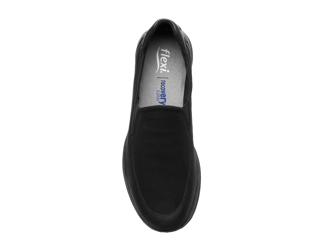 Zapato plano Flexi Helga para mujer en color negro, estilo slip-on con detalles de malla y suela cómoda.