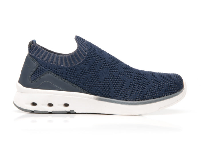 Zapato Flexi Fenix para mujer en color azul marino con suela blanca, diseño slip-on de tejido flexible.