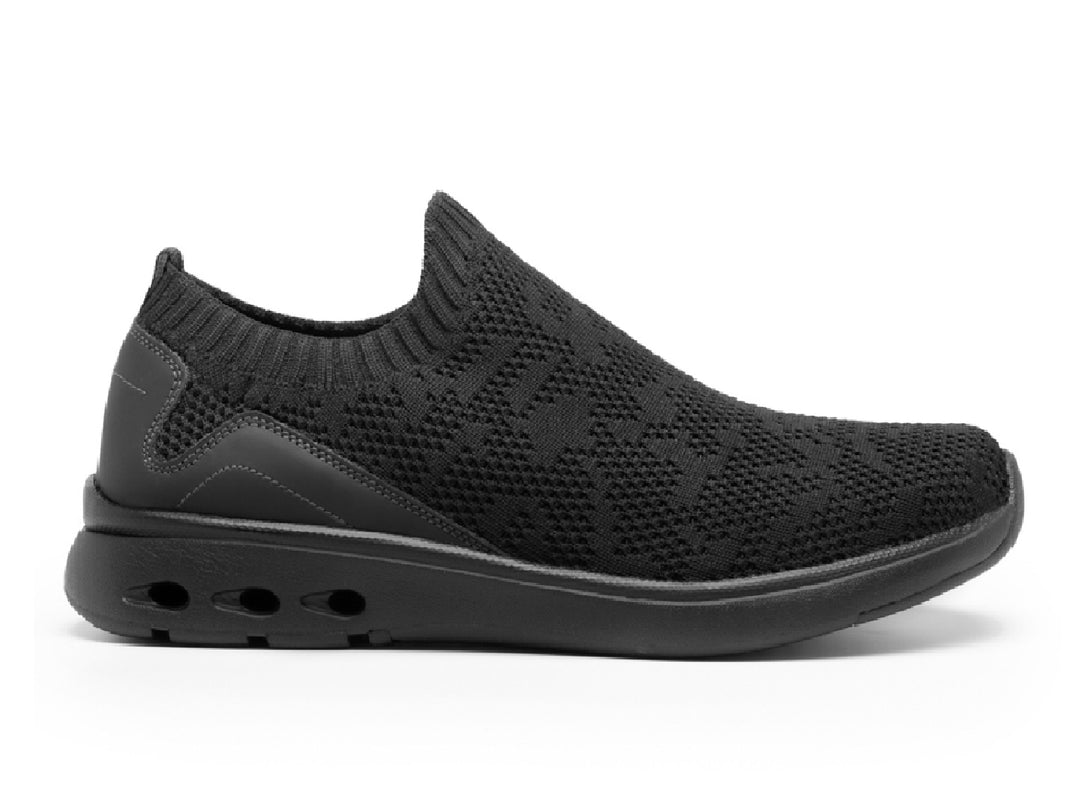 Zapato slip-on Flexi Fenix para mujer en color negro con acabado tejido y suela cómoda.