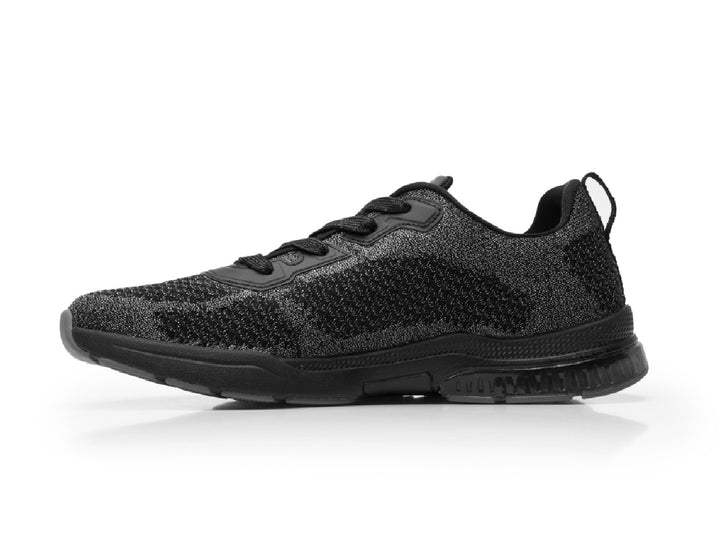 Tenis Flexi Casiopea para mujer en color negro con acabado tejido y suela deportiva.