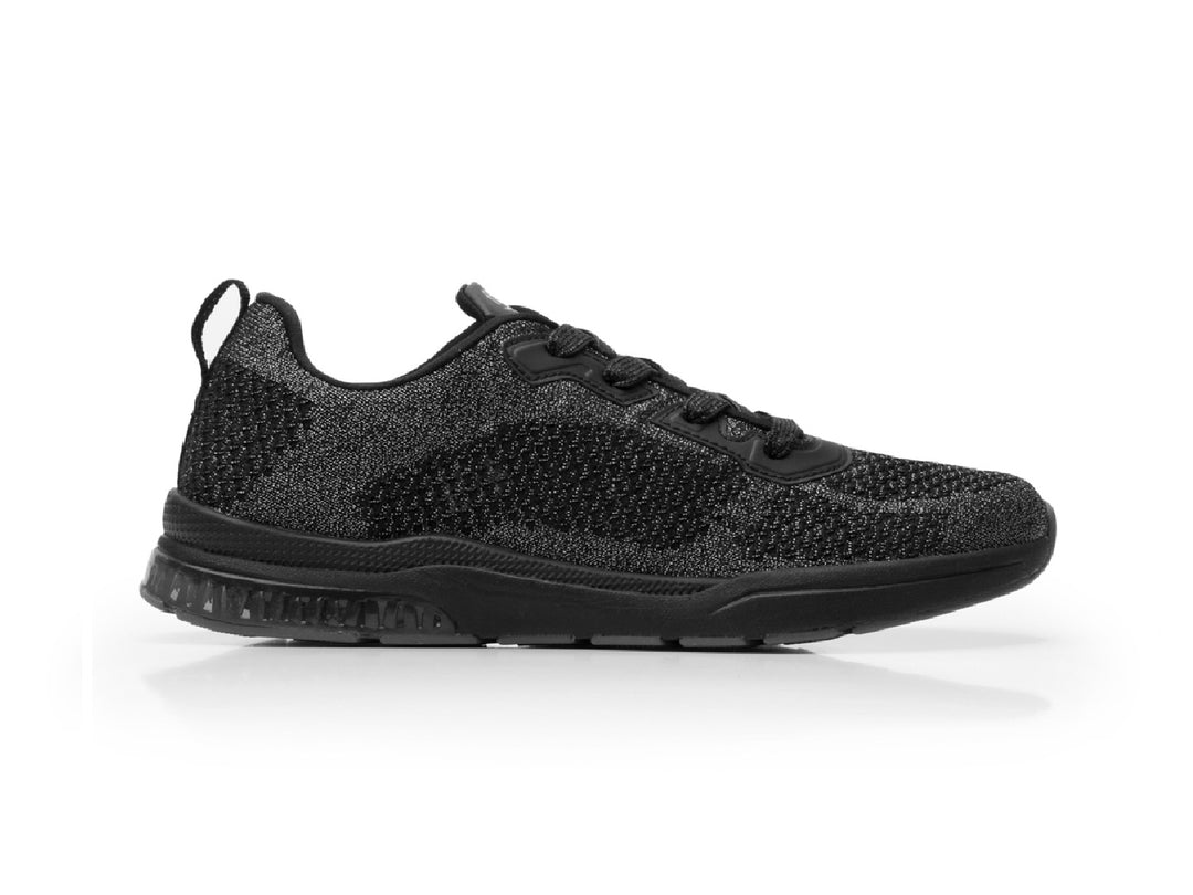 Tenis Flexi Casiopea para mujer en color negro con acabado tejido y suela deportiva.