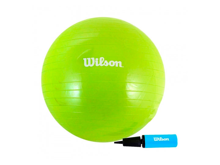 Pelota de yoga y pilates color amarillo marca Wilson con inflador incluido sobre fondo blanco.