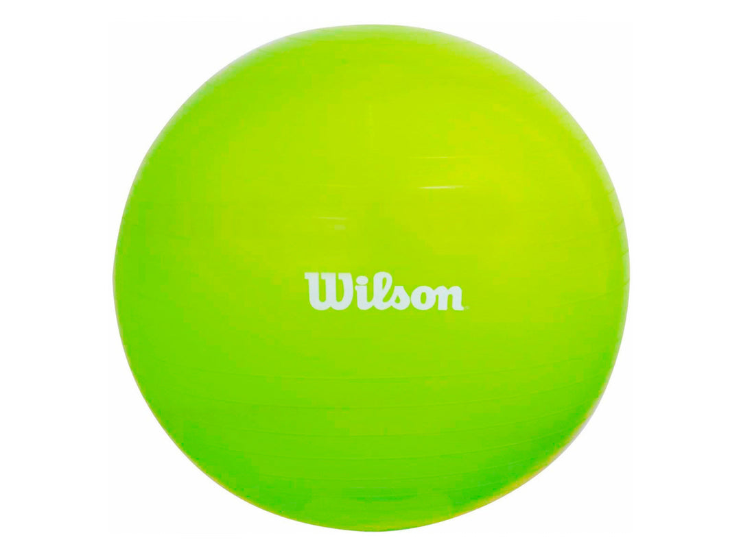 Pelota de yoga y pilates color amarillo marca Wilson con inflador incluido sobre fondo blanco.