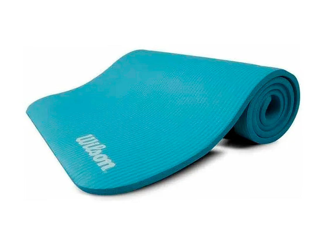 Tapete de yoga Wilson color morado, parcialmente enrollado sobre fondo blanco.