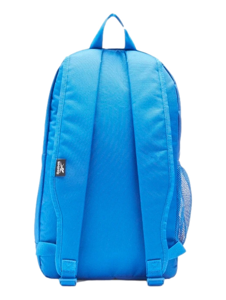 Mochila escolar Reebok de color azul con logotipo blanco y bolsillo lateral de malla.