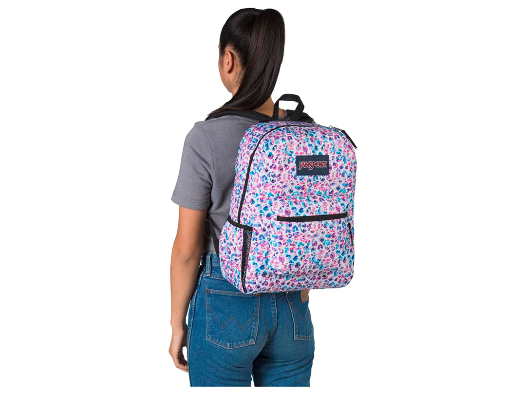 Mochila JanSport Cross Town con estampado multicolor de puntos tipo leopardo en tonos rosa, púrpura y azul.