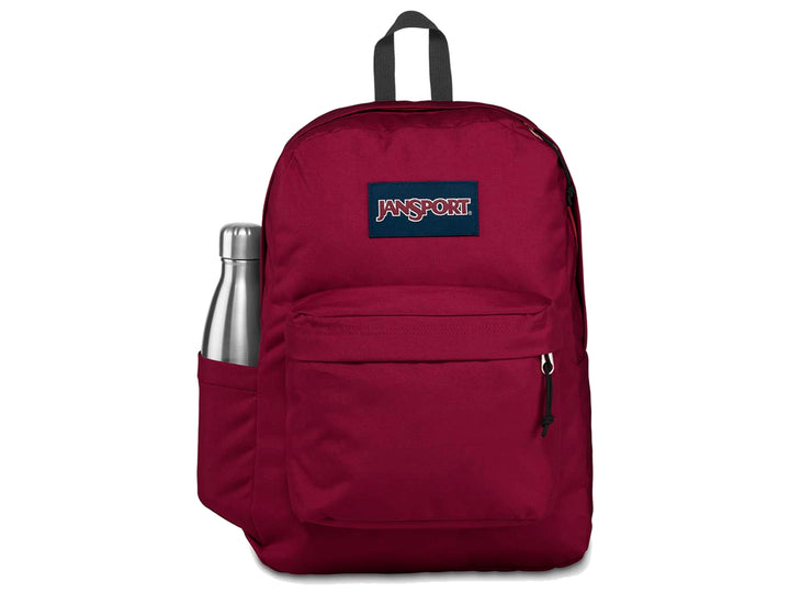 Mochila escolar JanSport color rojo russet con bolsillo frontal y asa superior.