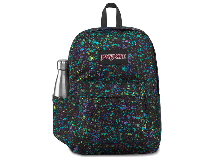 Mochila JanSport SuperBreak negra con estampado de salpicaduras en tonos azul, verde y morado.
