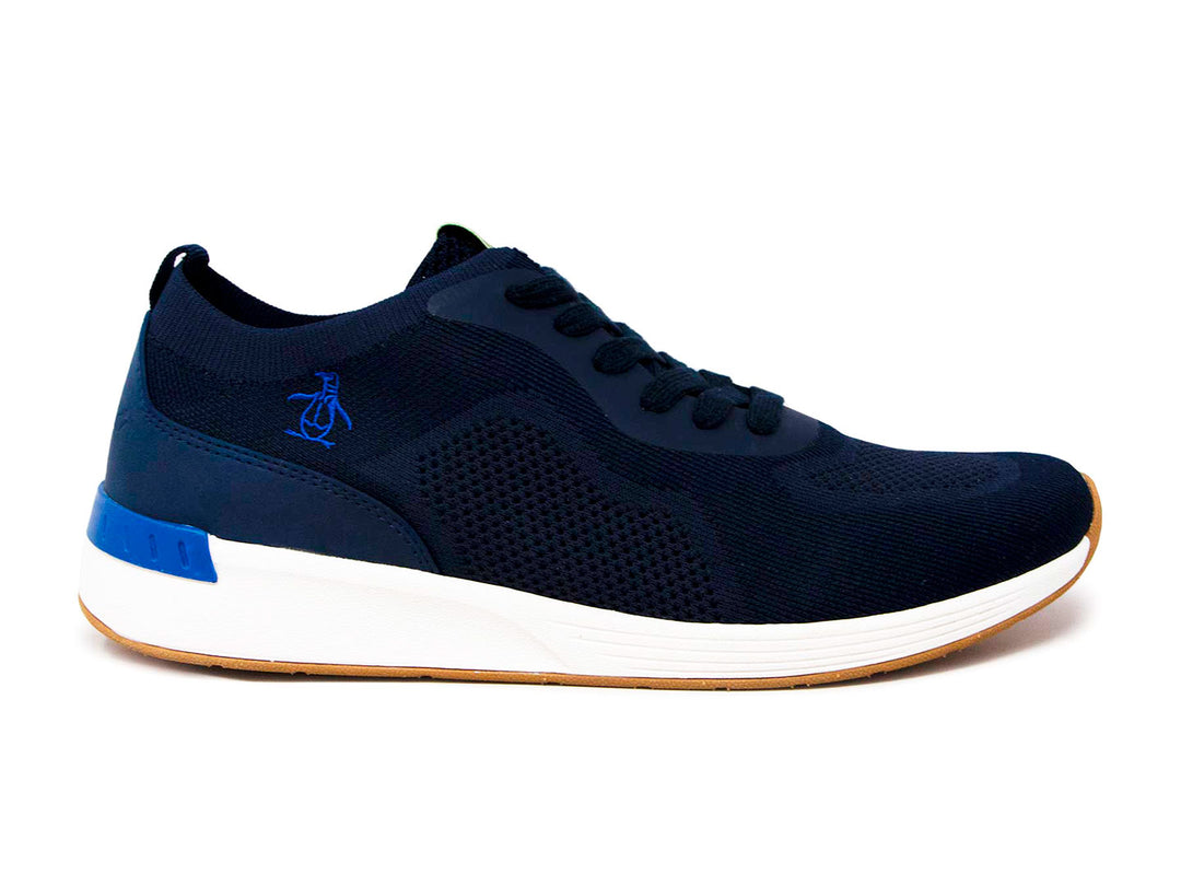 Tenis deportivos Penguin color azul marino con suela blanca y base color miel.