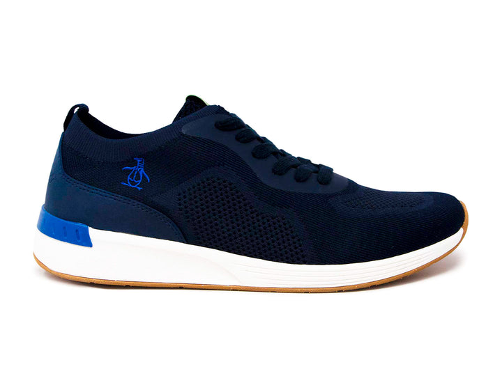 Tenis deportivos Penguin color azul marino con suela blanca y base color miel.
