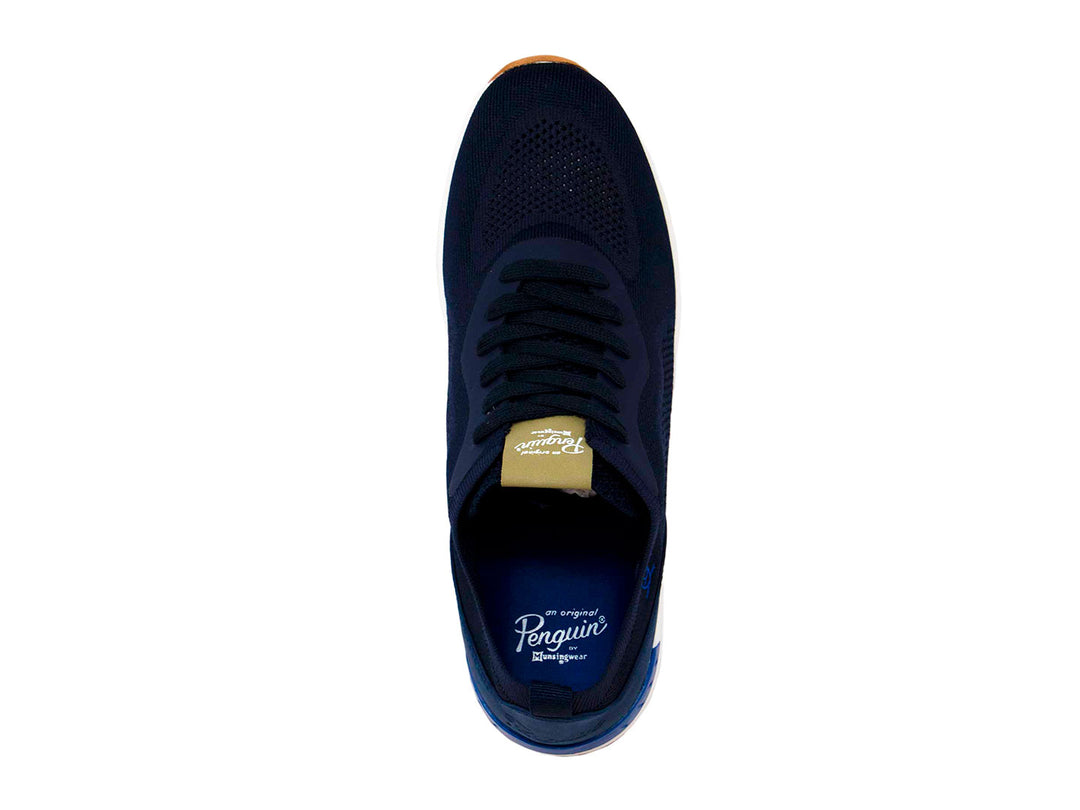 Tenis deportivos Penguin color azul marino con suela blanca y base color miel.