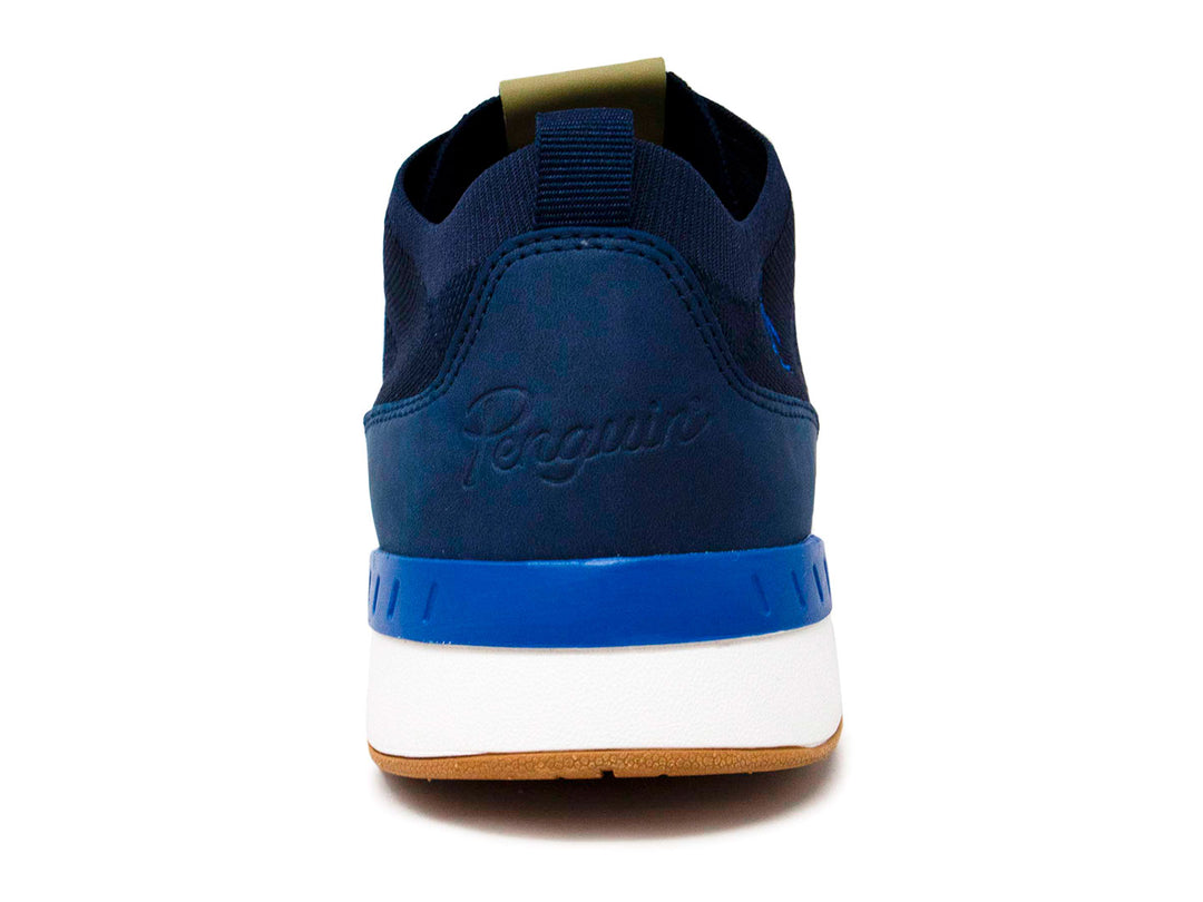 Tenis deportivos Penguin color azul marino con suela blanca y base color miel.