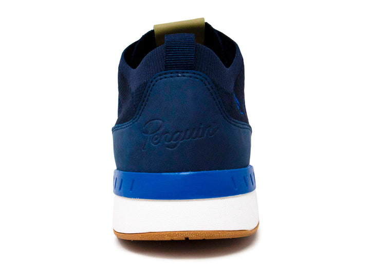 Tenis deportivos Penguin color azul marino con suela blanca y base color miel.