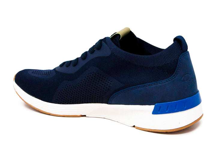 Tenis deportivos Penguin color azul marino con suela blanca y base color miel.