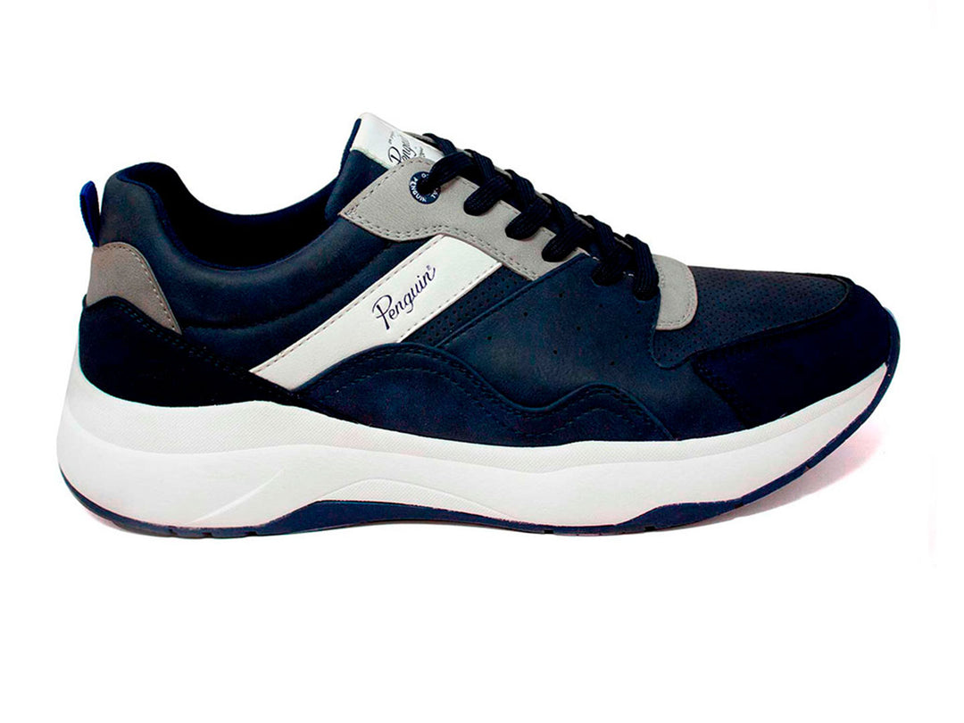 Tenis deportivos Penguin color azul marino con suela blanca y detalles en gris.