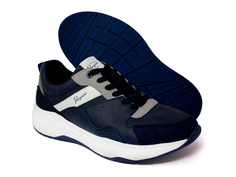 Tenis deportivos Penguin color azul marino con suela blanca y detalles en gris.