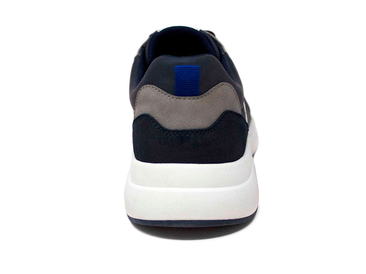 Tenis deportivos Penguin color azul marino con suela blanca y detalles en gris.