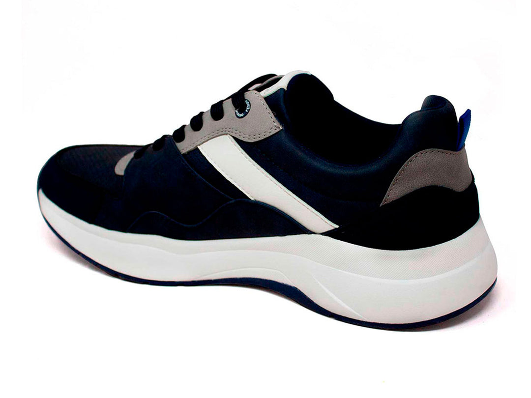 Tenis deportivos Penguin color azul marino con suela blanca y detalles en gris.